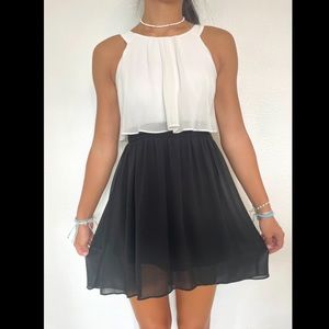 Formal black and white flowy dress with braided detail on waistline